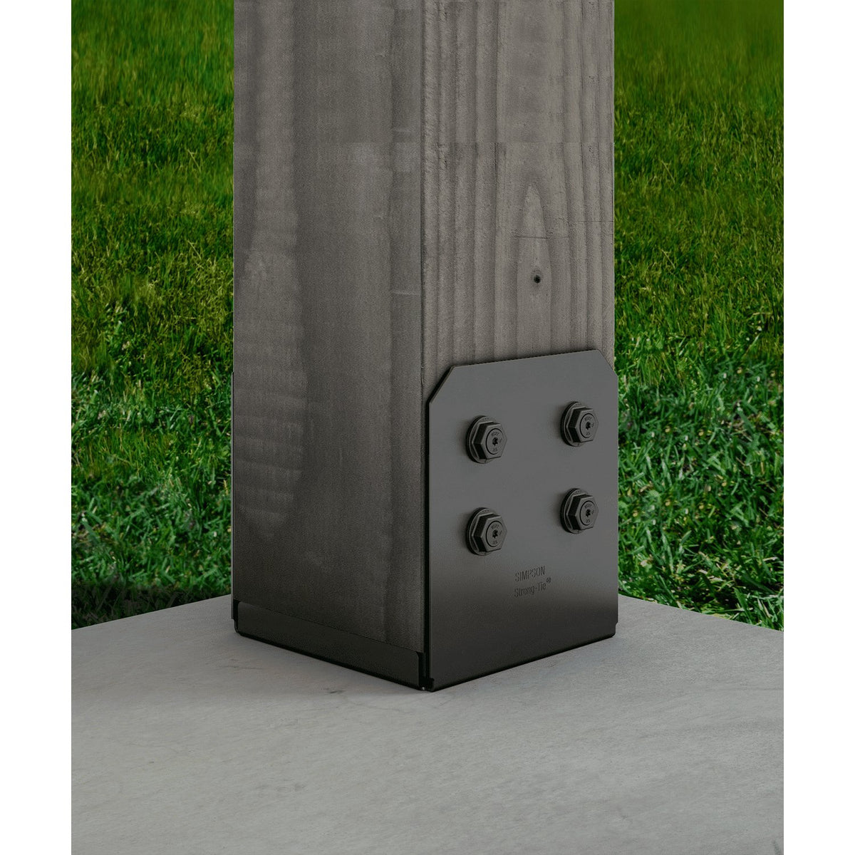 Black outdoor post base on a wooden post with grass in the background