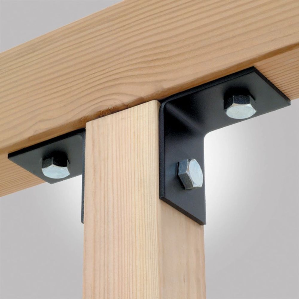 Black metal L-bracket hardware with silver hex bolts connecting a light wood post to a wooden beam, shown against a neutral gray background.