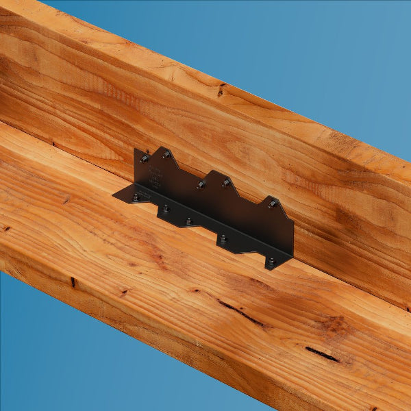 Black metal bracket on a wooden surface with a clear blue background
