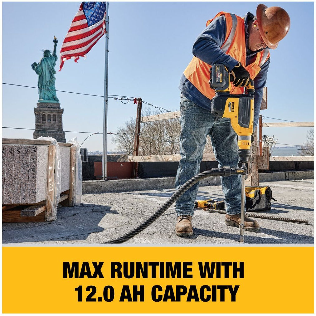 A man in a high-visibility safety vest operates a yellow and black industrial jackhammer drill on a rooftop, with the Statue of Liberty and an American flag in the background. A yellow banner at the bottom reads 'MAX RUNTIME WITH 12.