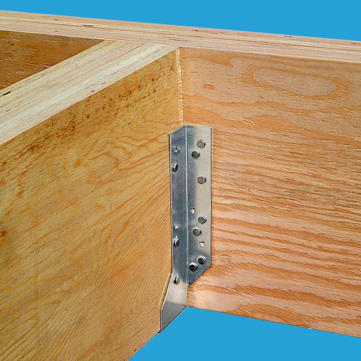 Wooden frame with a metal corner brace against a blue background