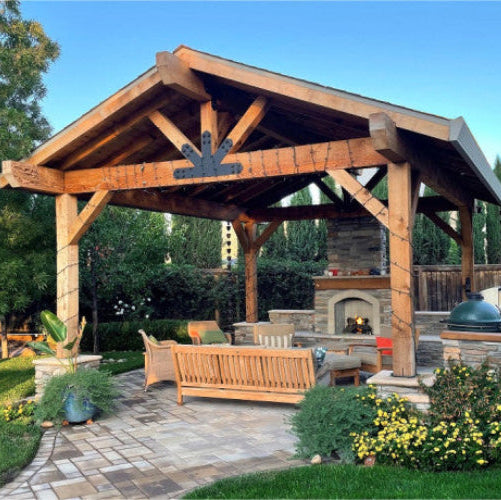 Wooden pergola with outdoor furniture and fireplace in a garden setting