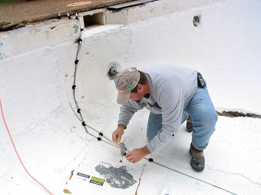 Person repairing a pool