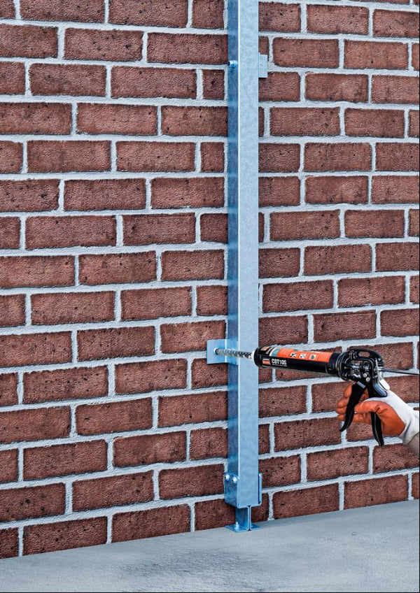 Drill against a brick wall