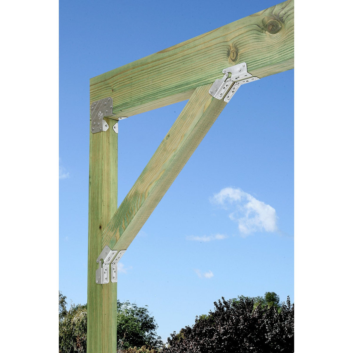 Wooden beam structure with brackets against a blue sky
