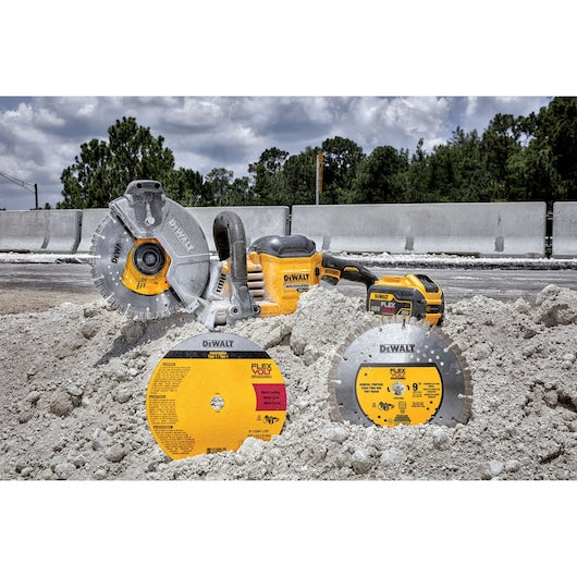 DeWalt circular saw and blades on a construction site with a cloudy sky.