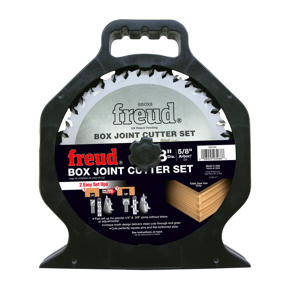 Freud box joint cutter set with a large circular saw blade mounted in a black plastic display holder, shown on a plain white background.