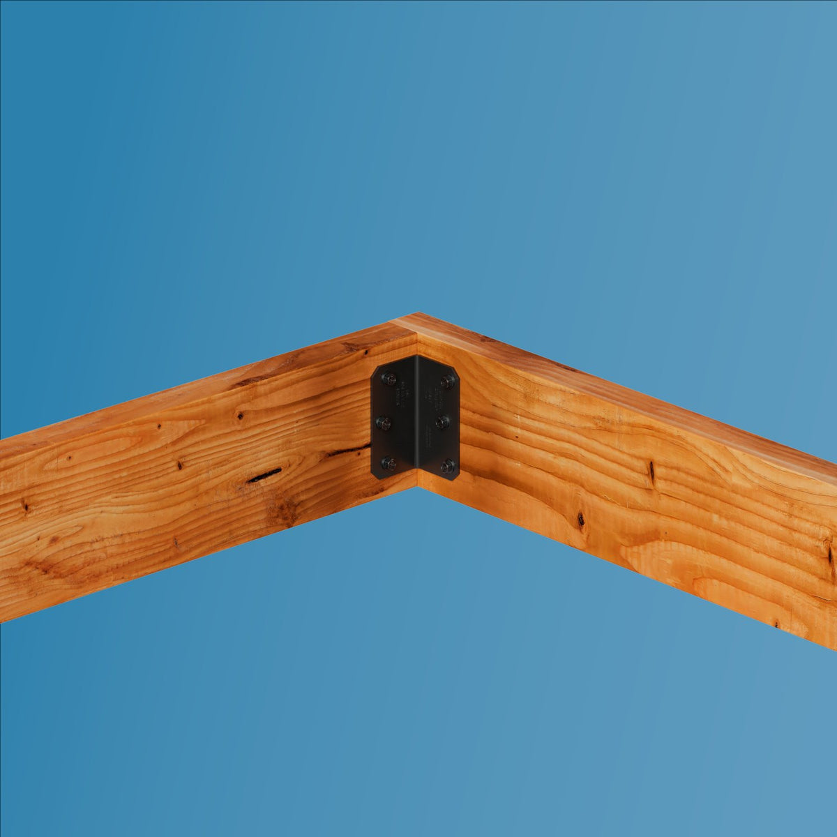 Black metal L-bracket corner connector joining two warm brown wooden beams against a solid blue background.