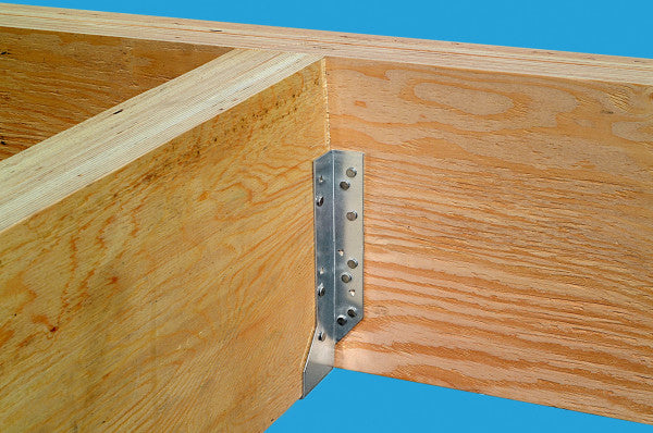 Wooden frame with a metal corner brace against a blue background