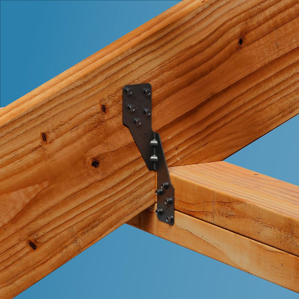 Wooden structure with metal bracket against a blue background