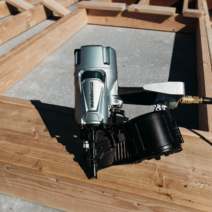 Nail gun on a wooden surface with a Metabo HPT logo