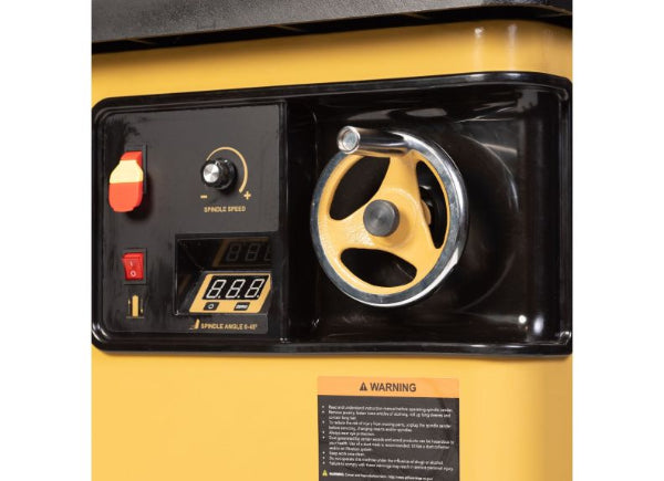 Close-up of a yellow generator with control panel and warning label.